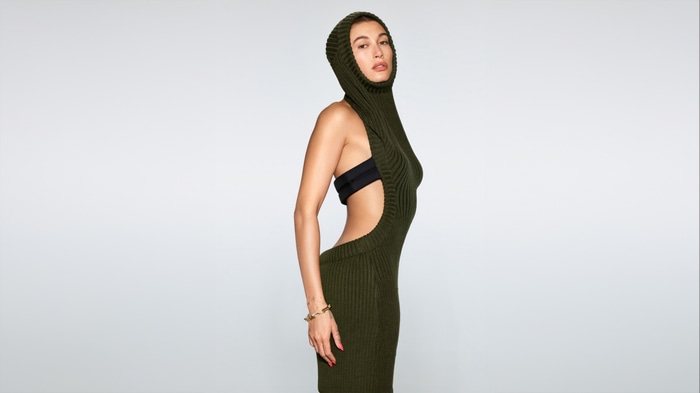 Hailey Bieber in a green knit dress with hood