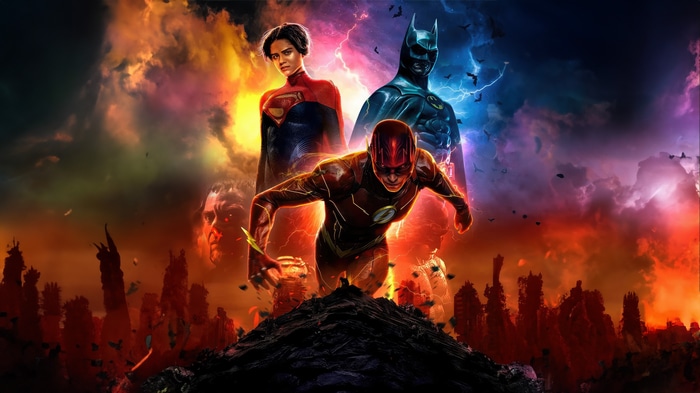The Flash, Supergirl, and Batman in a chaotic scene