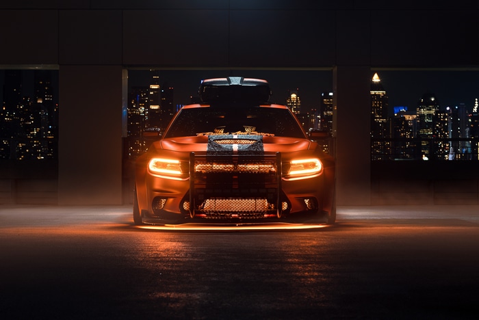 Dodge Charger with a bull bar and roof box
