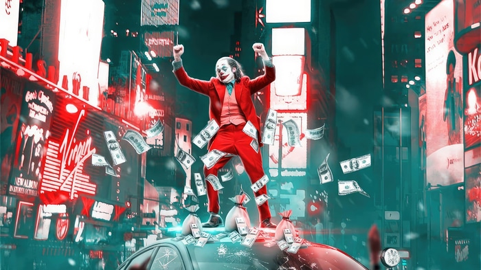 Joker standing on a car with money falling