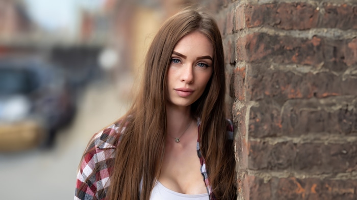 Young woman with long brown hair outdoors