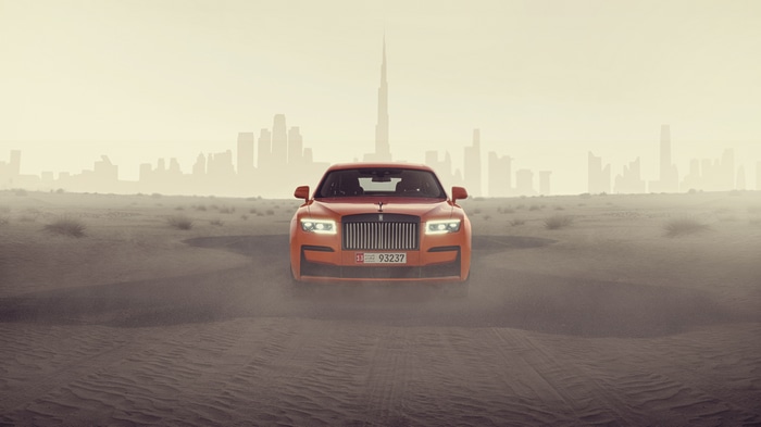 Orange Rolls Royce Ghost in Dubai Desert