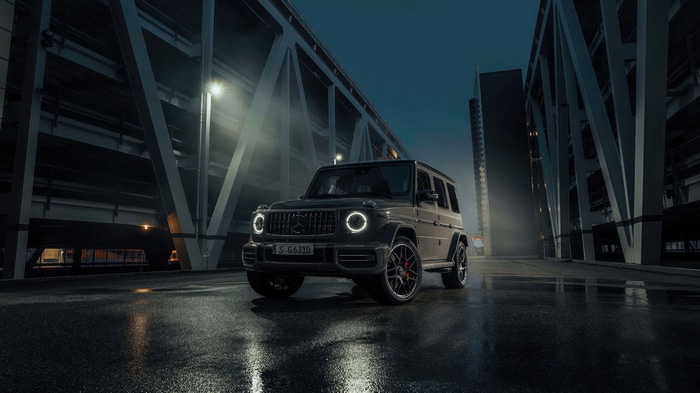 Mercedes-Benz G-Class SUV on wet road at night