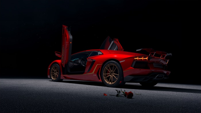Red Lamborghini Aventador SVJ with doors open