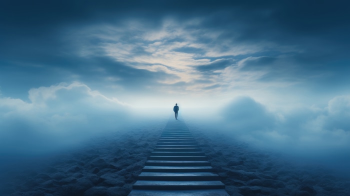 Man walking up stairs in clouds