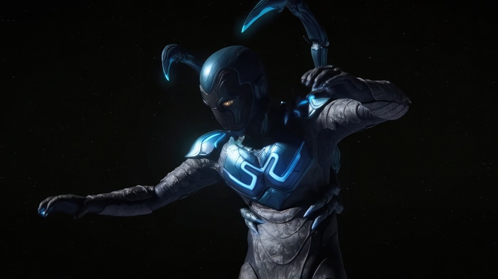Blue Beetle in armor with scorpion tail