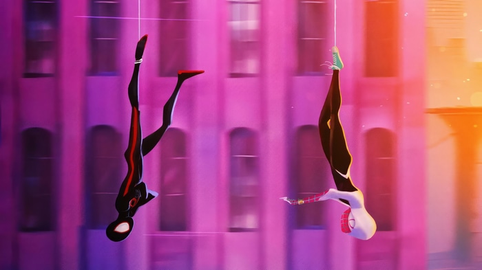 Spider-Man and Gwen Stacy swinging through a city