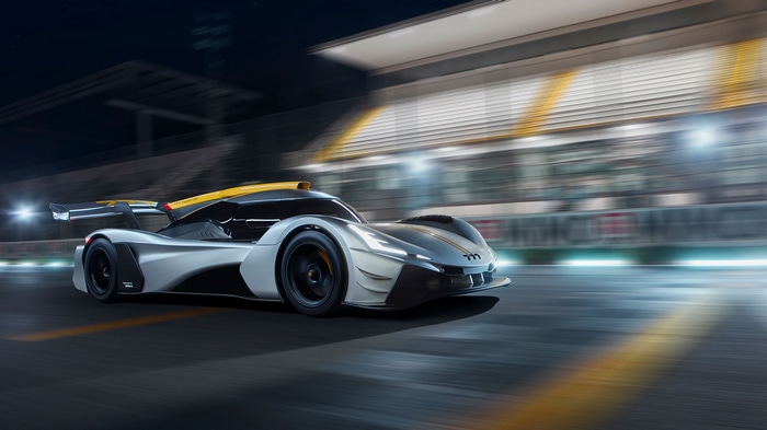 777 Hypercar racing on a track at night