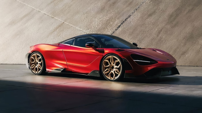 Red McLaren 765LT sports car with gold wheels
