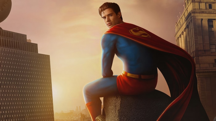 Superman sitting on a building ledge