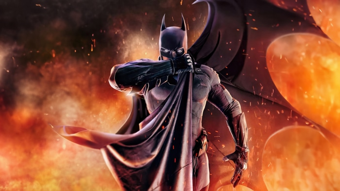 Batman in front of a fiery background