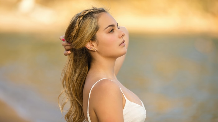 Girl with blonde hair in a white dress