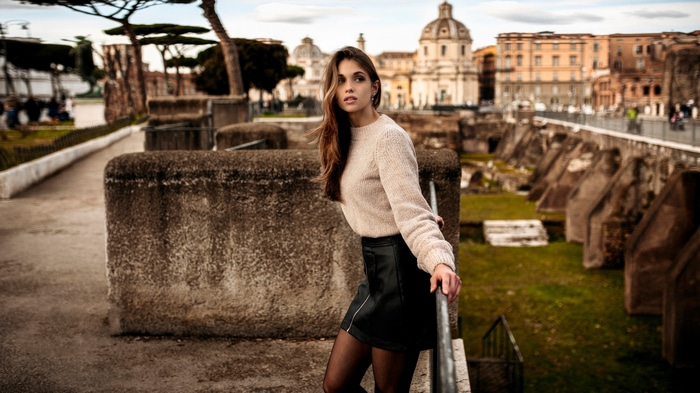 Model in a black skirt and sweater in Rome