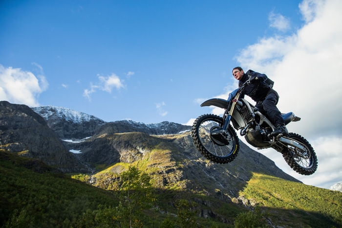 Tom Cruise performs a motorcycle jump in Mission Impossible