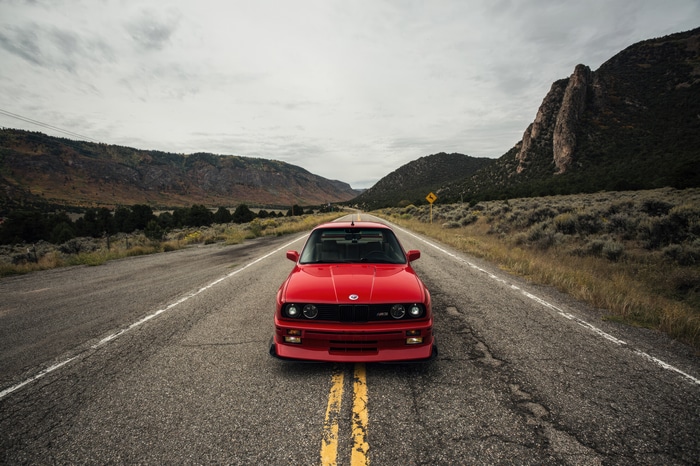 Red BMW M3 E30 on a Mountain Road 4K