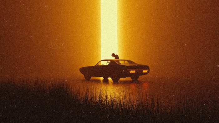 Person on car under light beam 4K