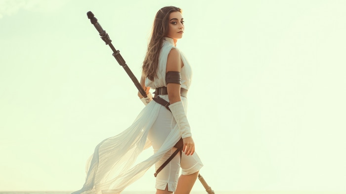 Rey from Star Wars holding a staff