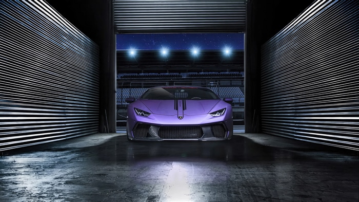 Purple Lamborghini Huracan in a garage
