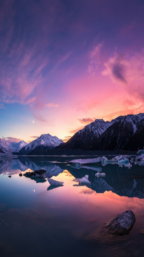 Mountains reflected in a lake at sunset