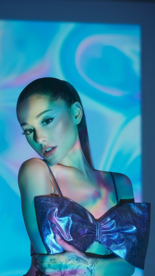 Ariana Grande in a metallic bow top