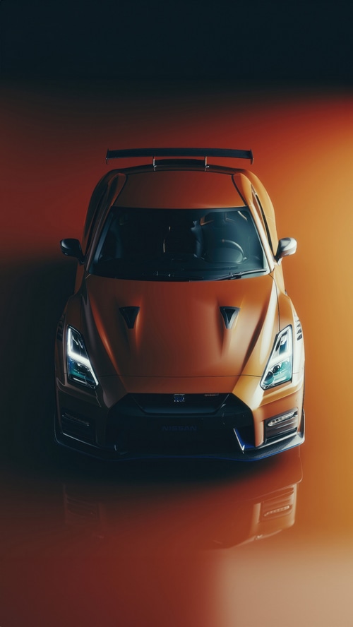 Orange Nissan GT-R with a rear spoiler