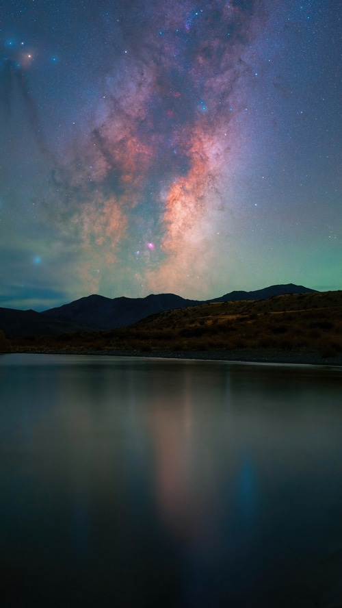 Milky Way over mountains and lake