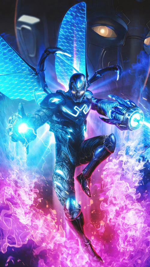 Blue Beetle in action with glowing wings and energy blasts