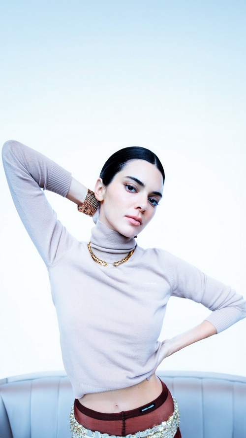 Kendall Jenner in a beige turtleneck and sheer bottoms