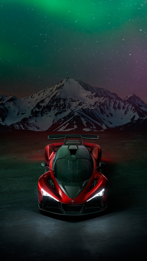 Red Zenvo Aurora Agil sports car under aurora borealis