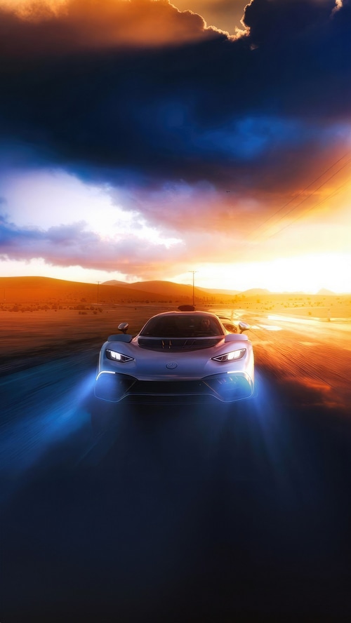 Mercedes-Benz driving on a road at sunset