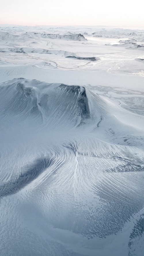 Snowy Icelandic landscape with mountains and rivers