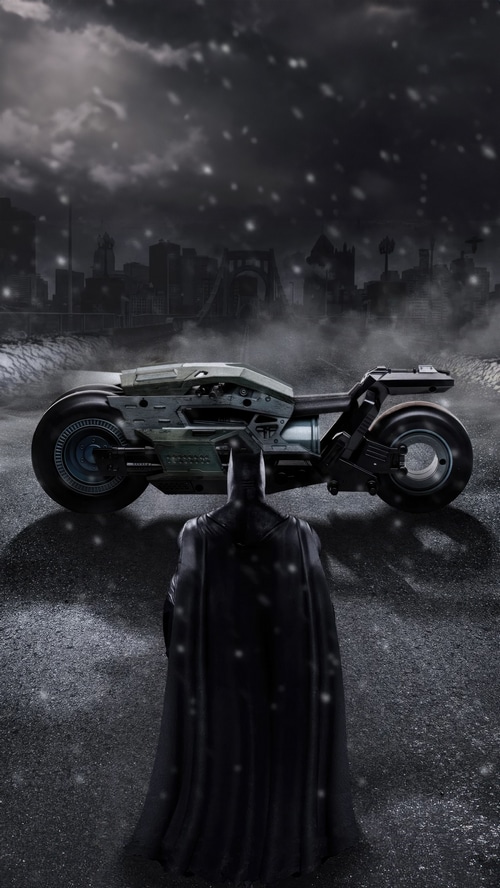 Batman and Batcycle in a snowy city