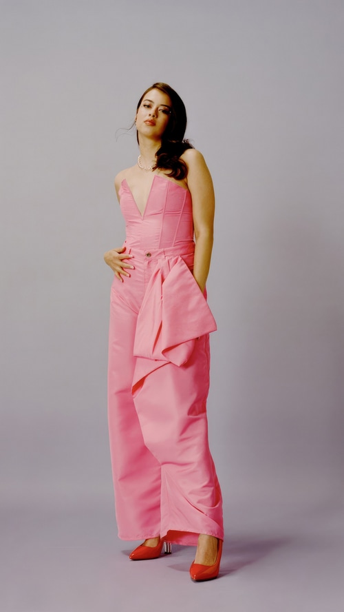 Amber Midthunder in a pink outfit