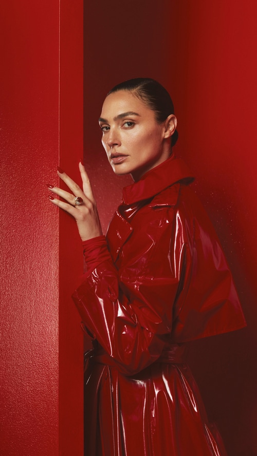Gal Gadot in a red vinyl trench coat