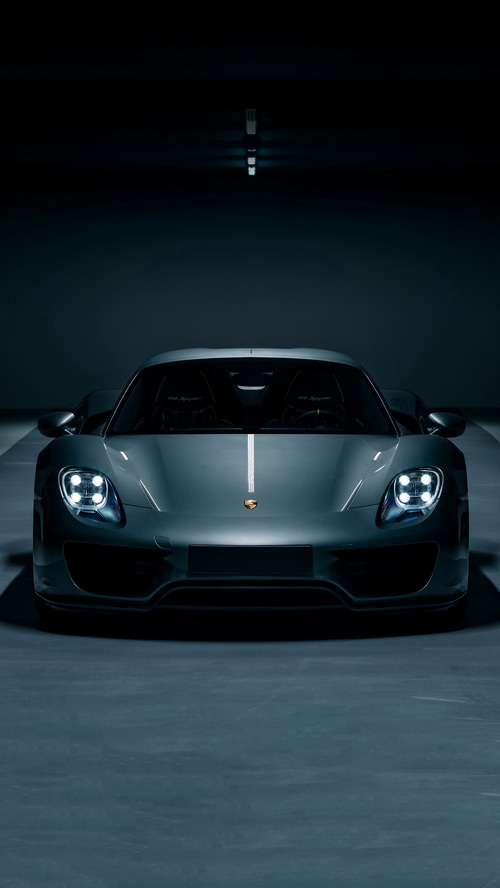 Porsche 918 Spyder in a dark garage