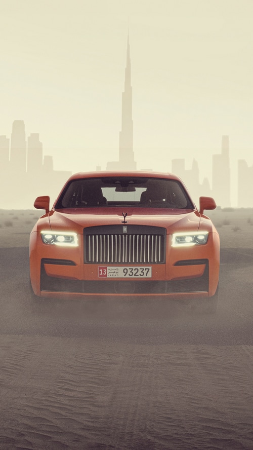 Orange Rolls-Royce Ghost in Dubai Desert