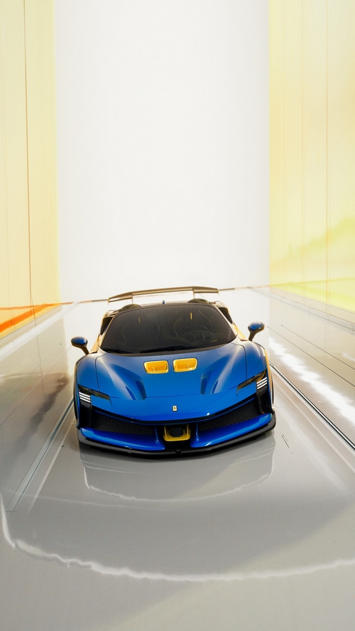Blue Ferrari SF90 XX Spider in a tunnel