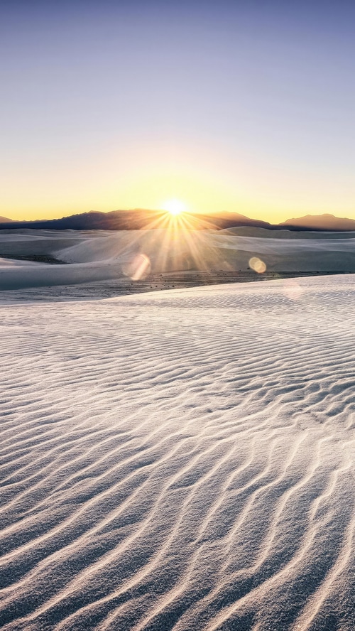 Sunrise over White Sands National Park dunes