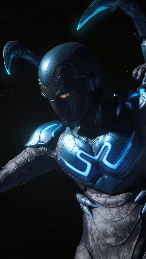Blue Beetle in a dark setting