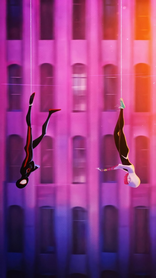 Spider-Man and Spider-Gwen swinging in a city