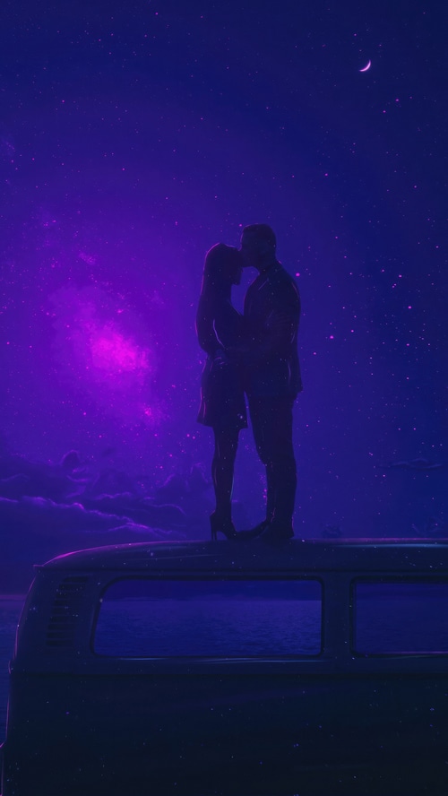 Couple kissing on a van roof under a starry sky