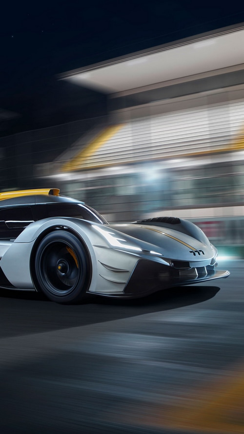 777 Hypercar racing on a track at night