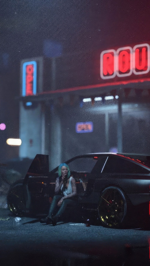 Woman sitting in a car at night