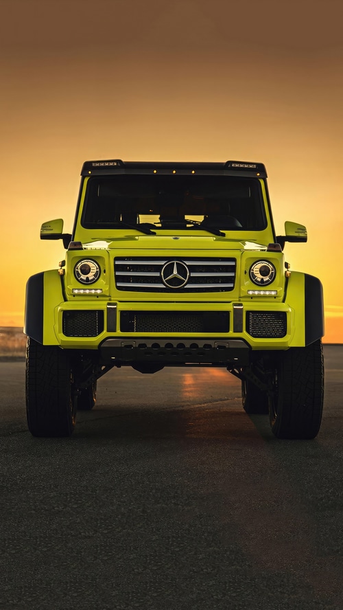 Yellow Mercedes-Benz G-Class SUV at Sunset