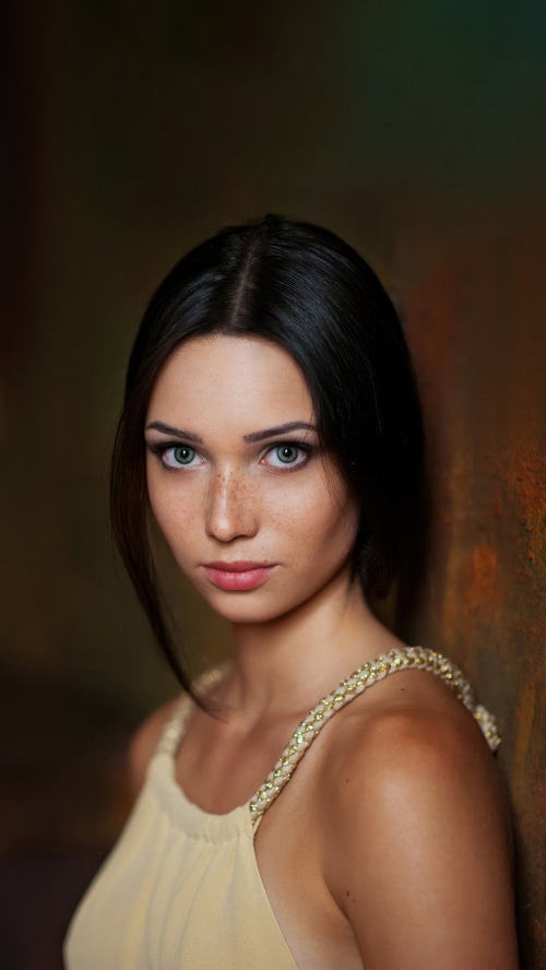 Young woman with blue eyes and freckles