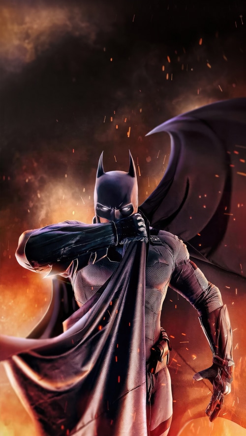 Batman in a dark, fiery environment