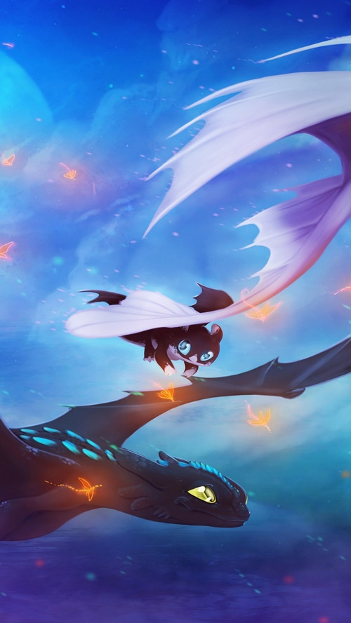 Night Fury dragons flying in a blue sky