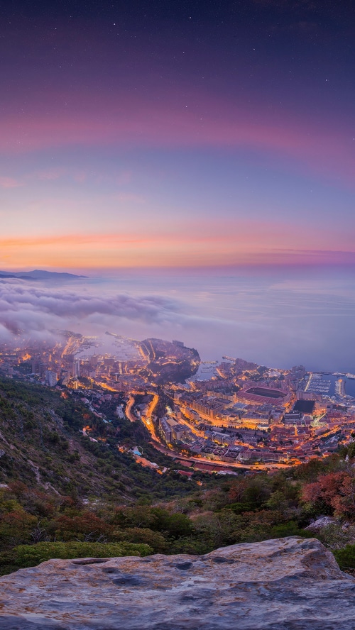 Monaco cityscape at sunset from a mountain viewpoint