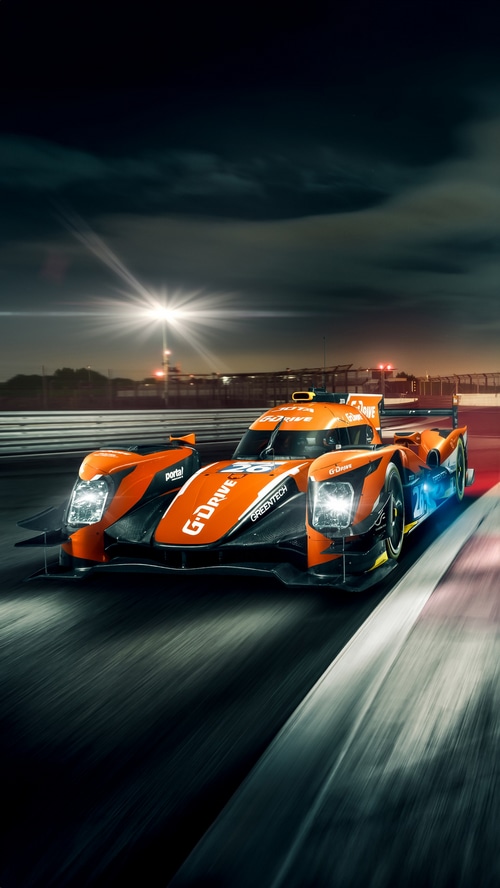 G-Drive Racing Car on Track at Night