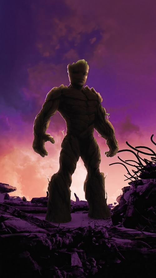 Groot standing in a destroyed landscape with purple sky